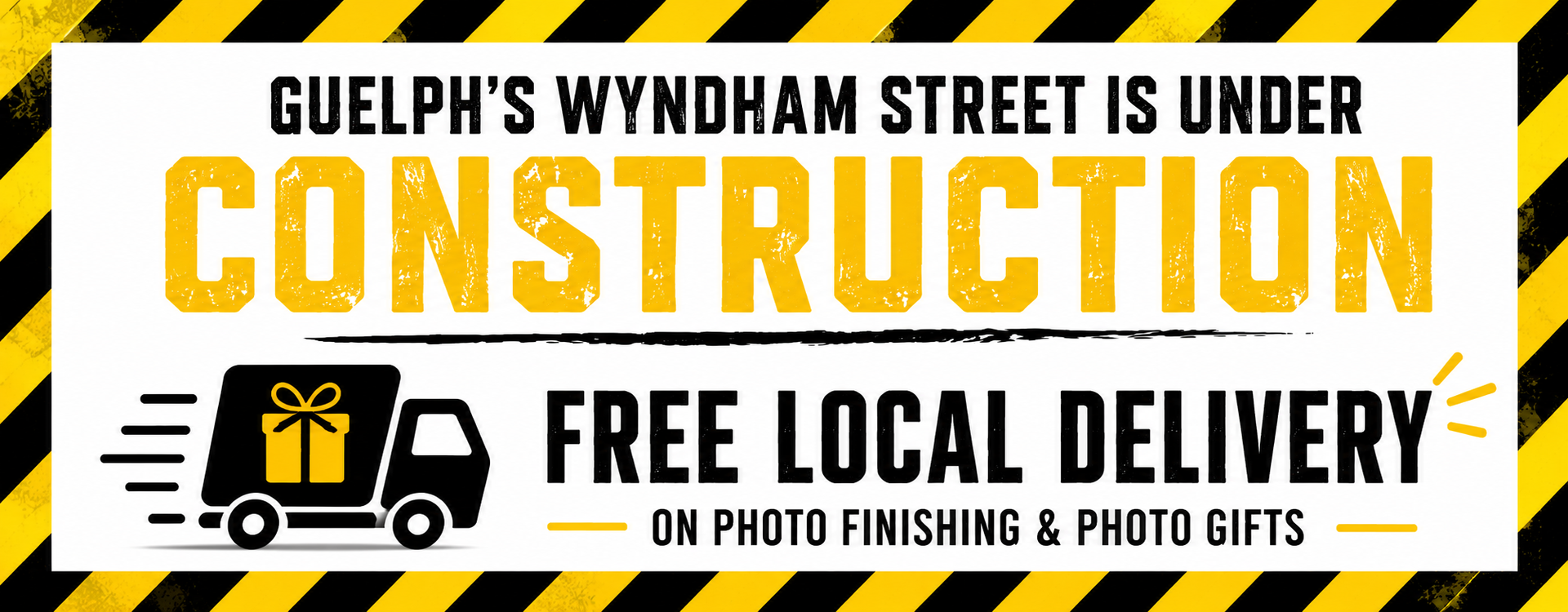 Guelph’s Wyndham Street under construction, with free local delivery announcement on yellow and black sign.