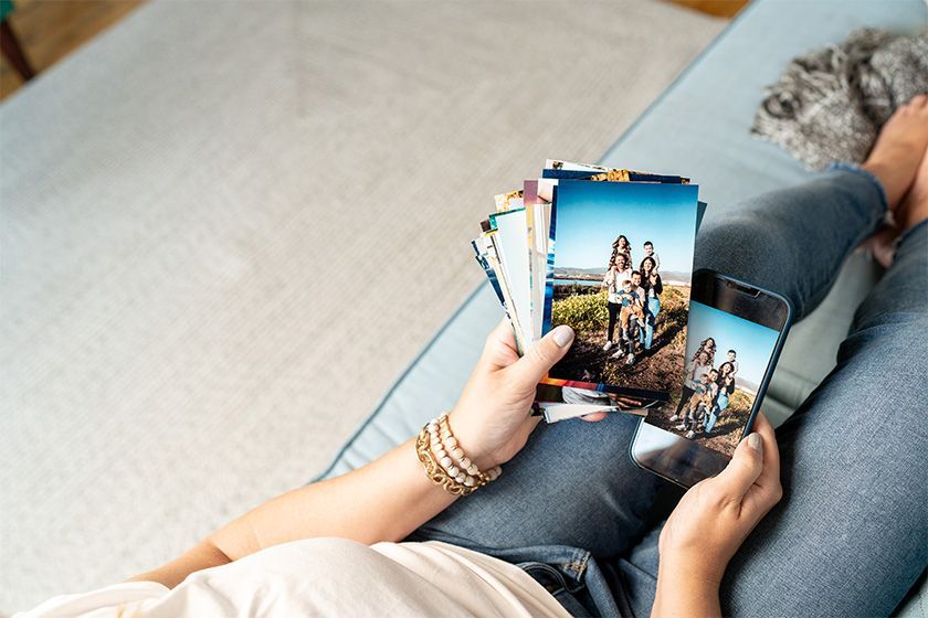 Lady looking at a picture on her couch