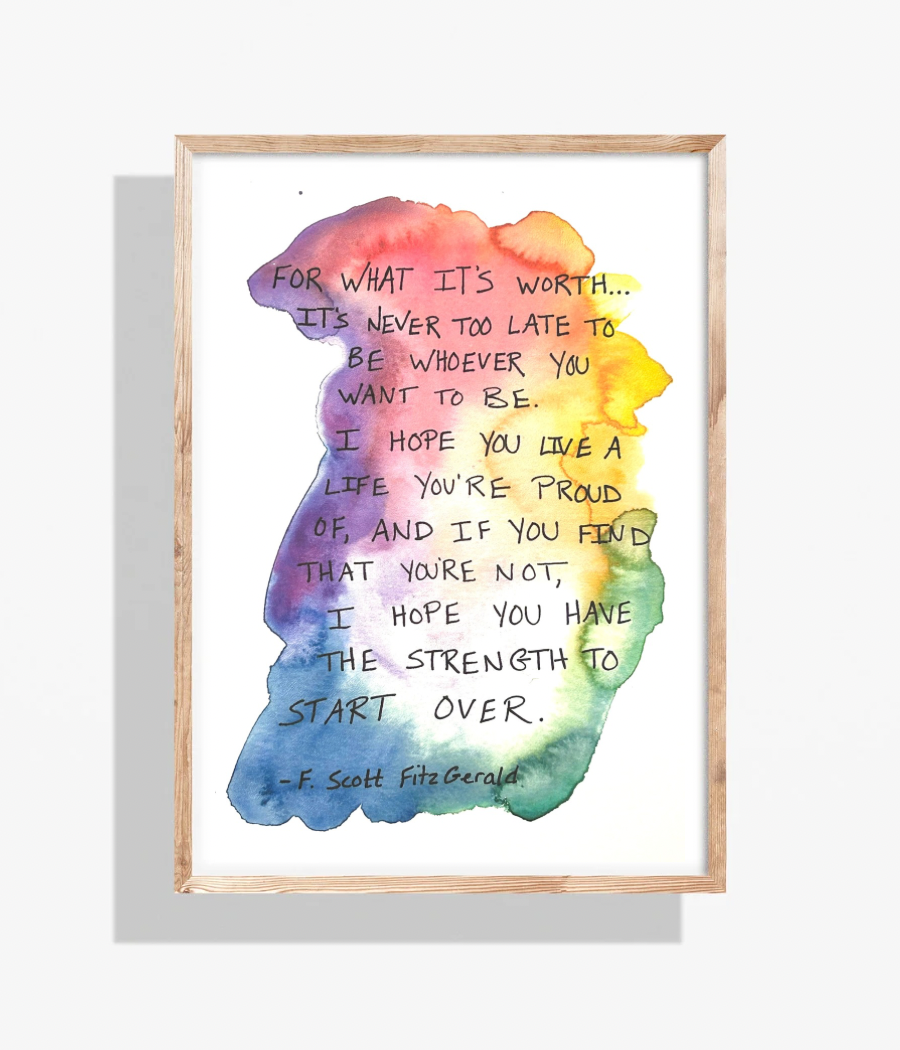 Watercolor art with rainbow colors and handwritten text in a wooden frame: 