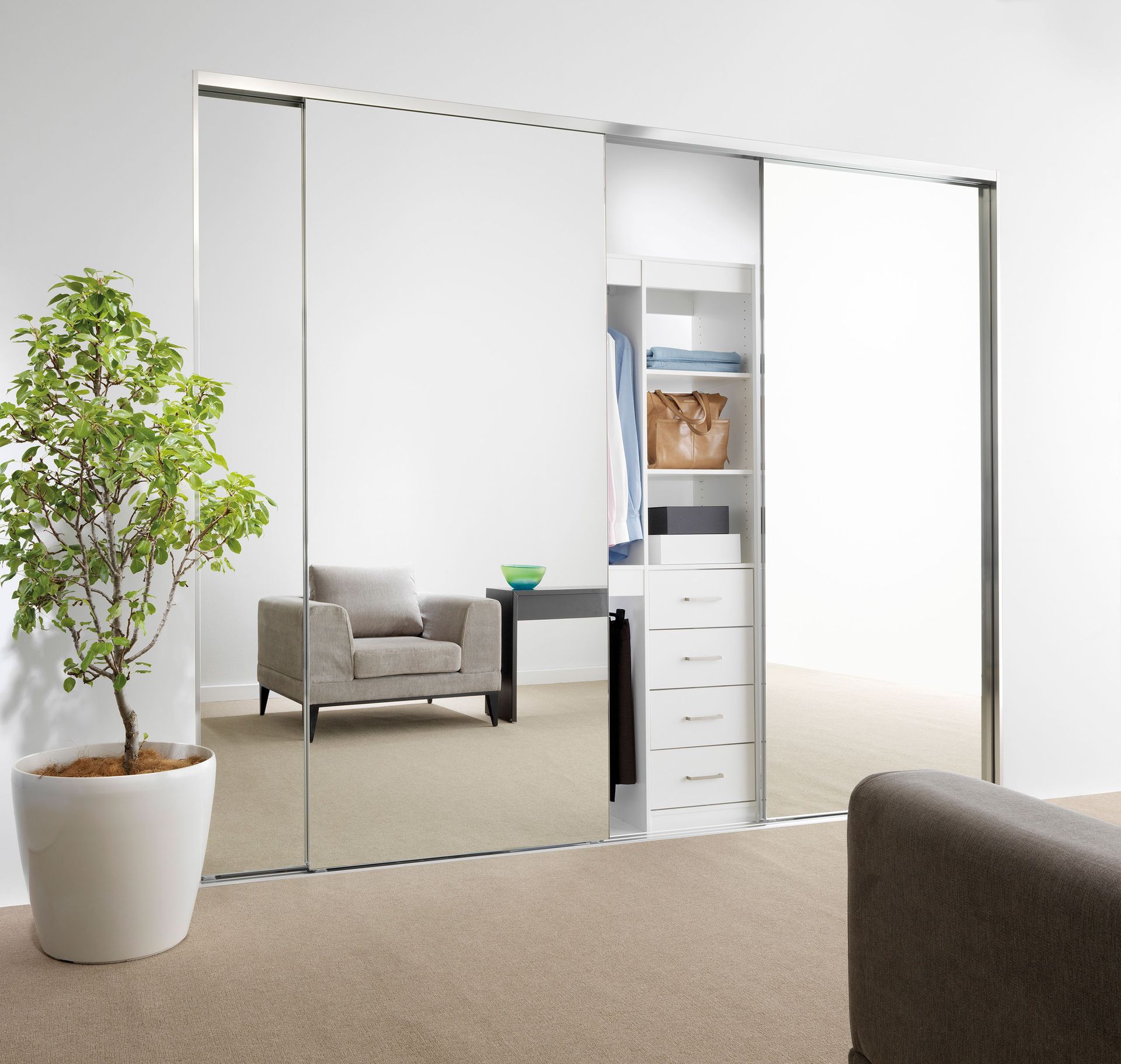 Frameless mirror sliding wardrobe doors in sitting room