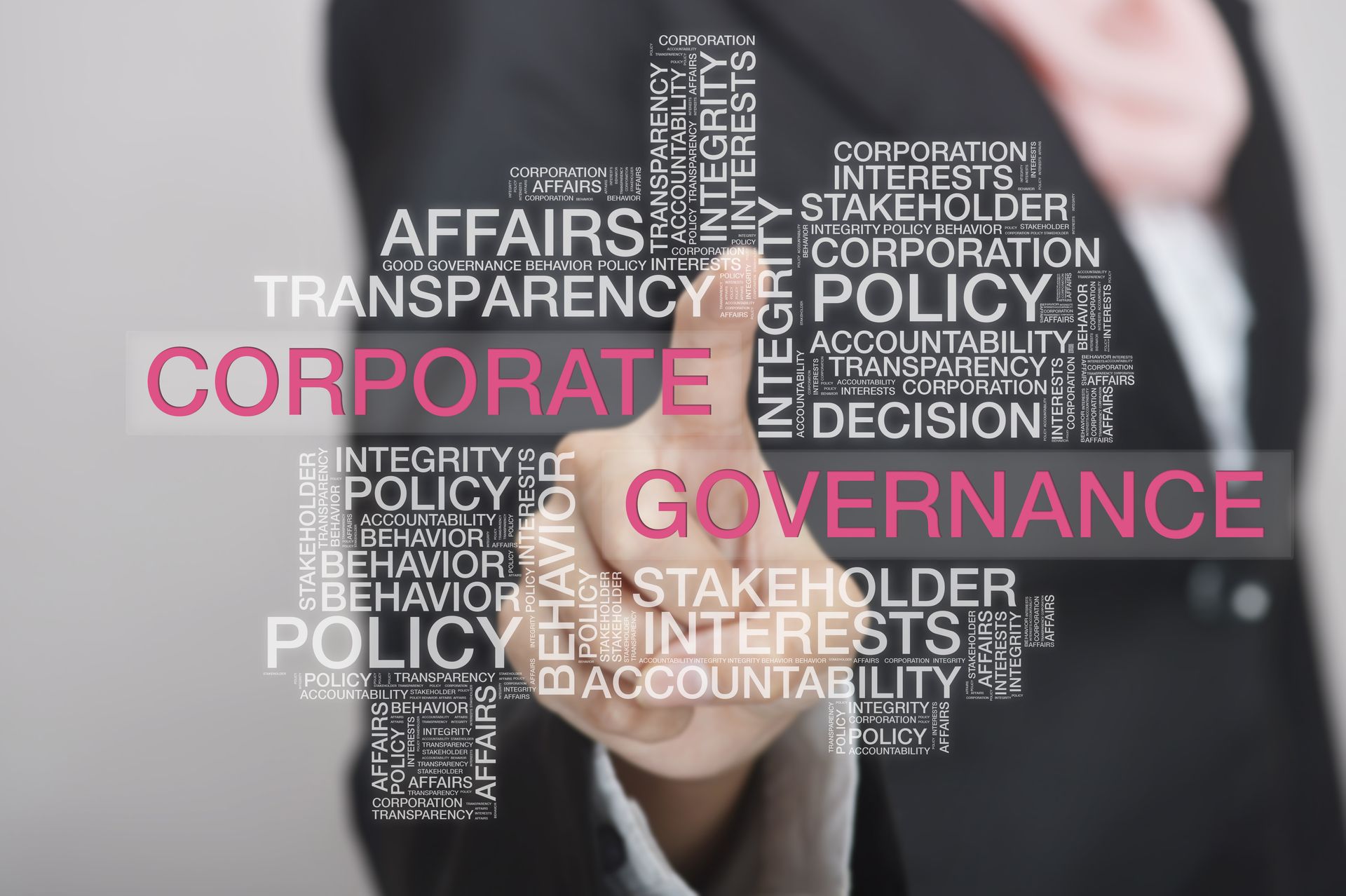 A man is pointing at the word corporate governance