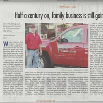Newspaper article about a family-owned plumbing business; man stands next to a red truck.