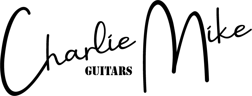 a black and white logo for charlie mike guitars