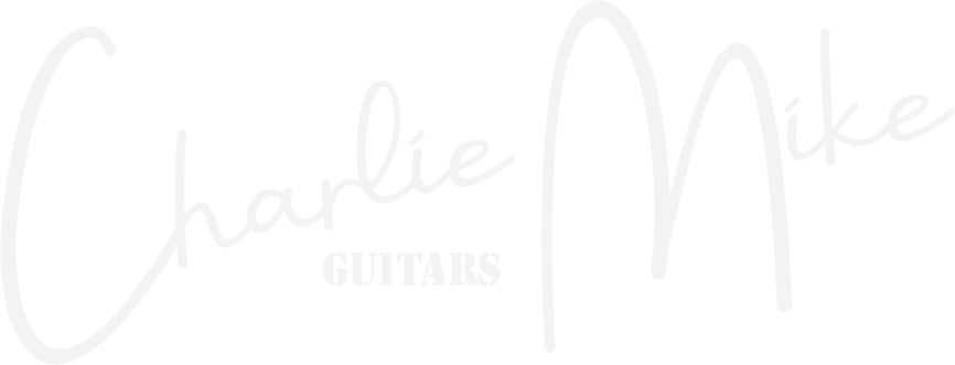 a white logo for charlie mike guitars on a white background .