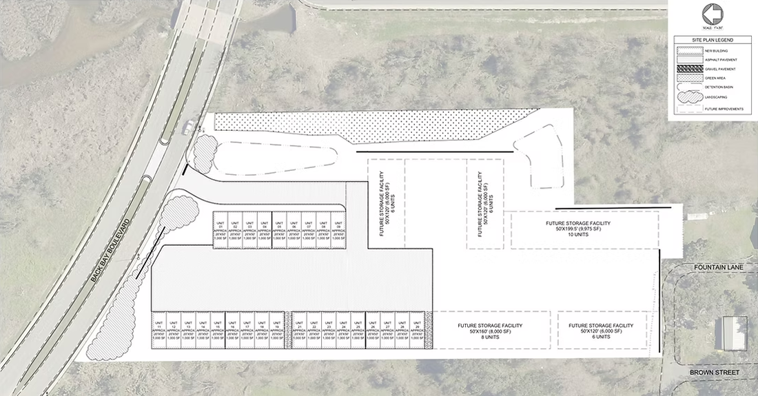 Detailed site plan of a building with parking, driveways, and surrounding roadways.
