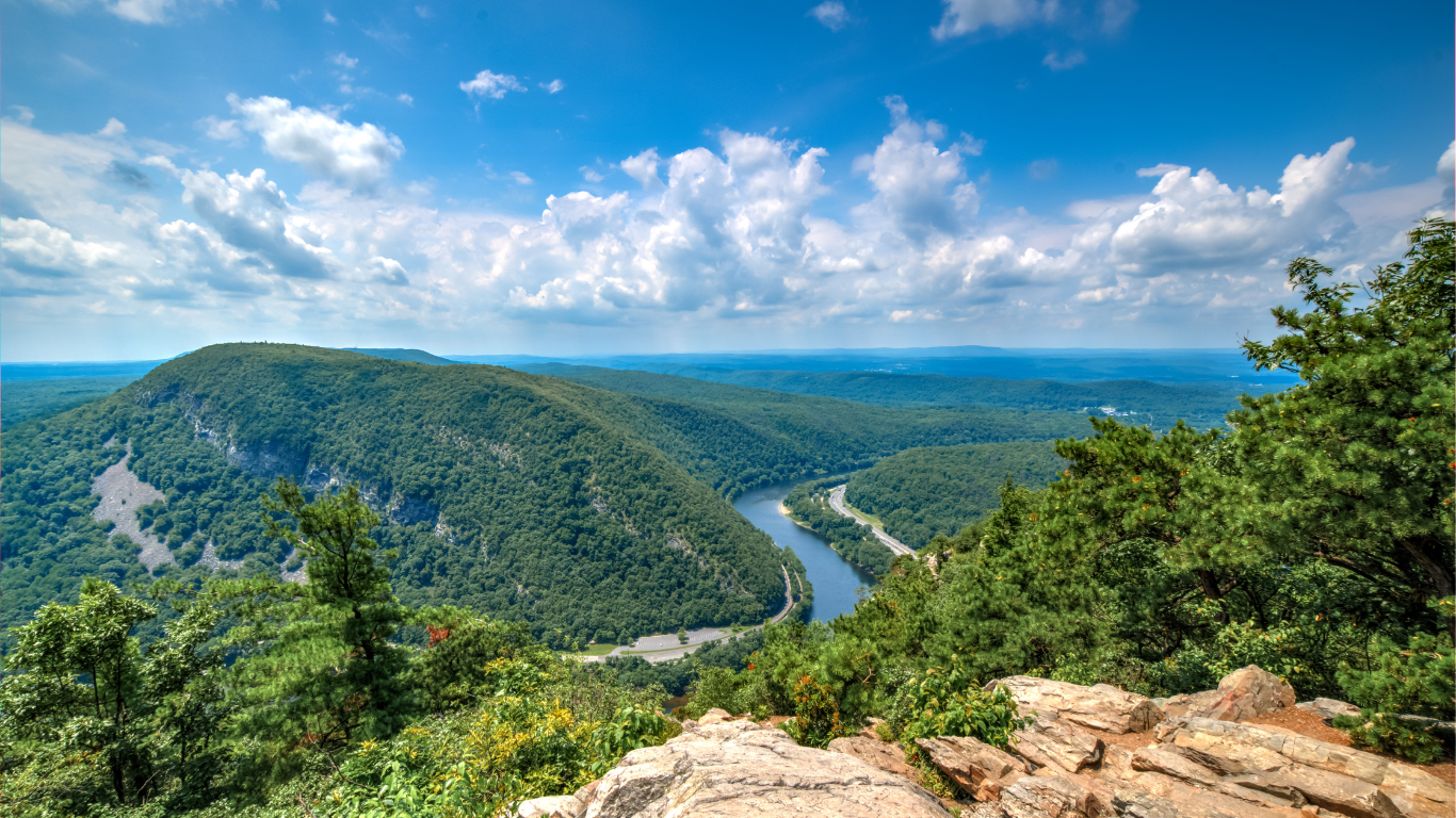 A view of a river surrounded by the Pocono mountains mountains near adventure sports