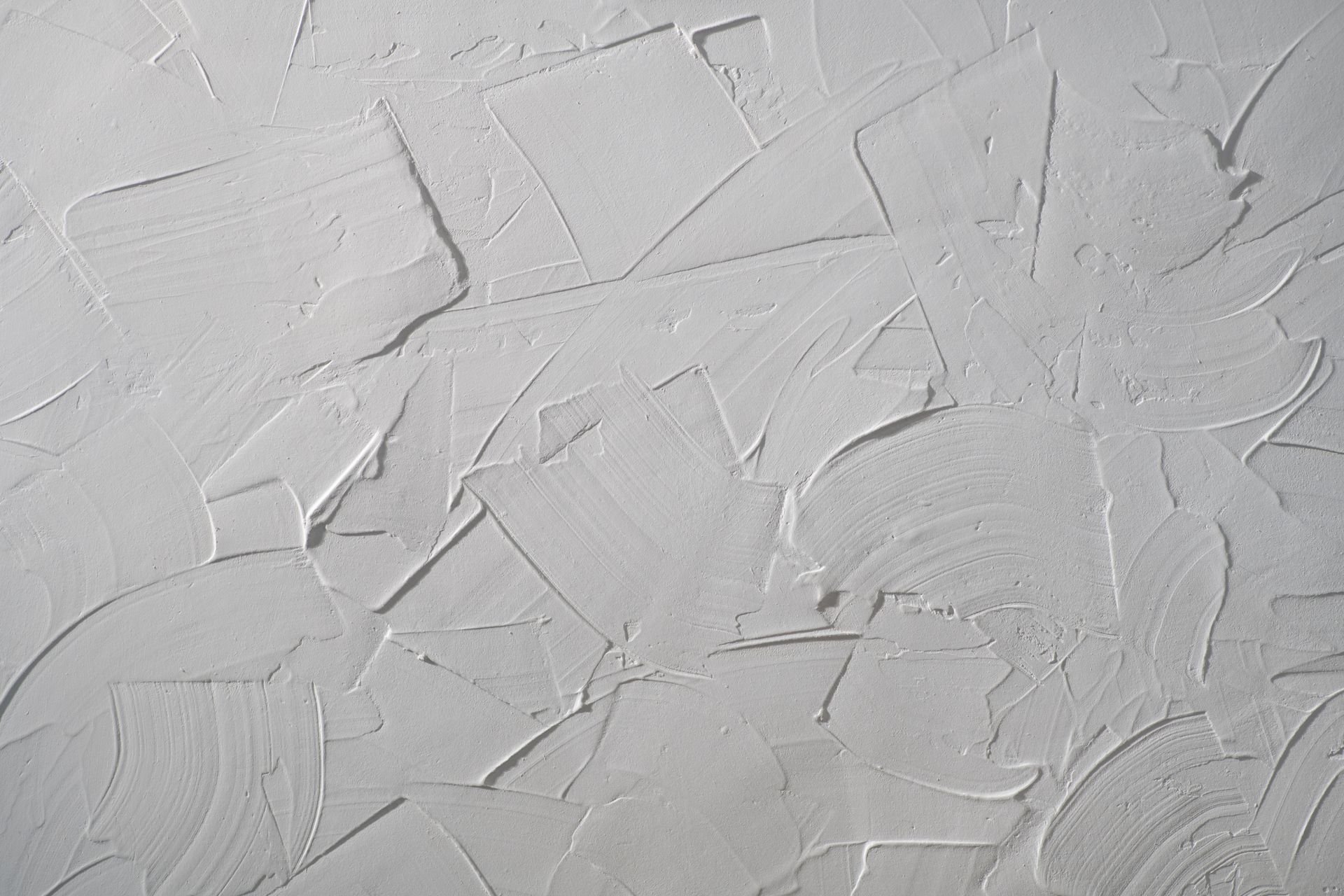 A close up of a white wall with a texture.