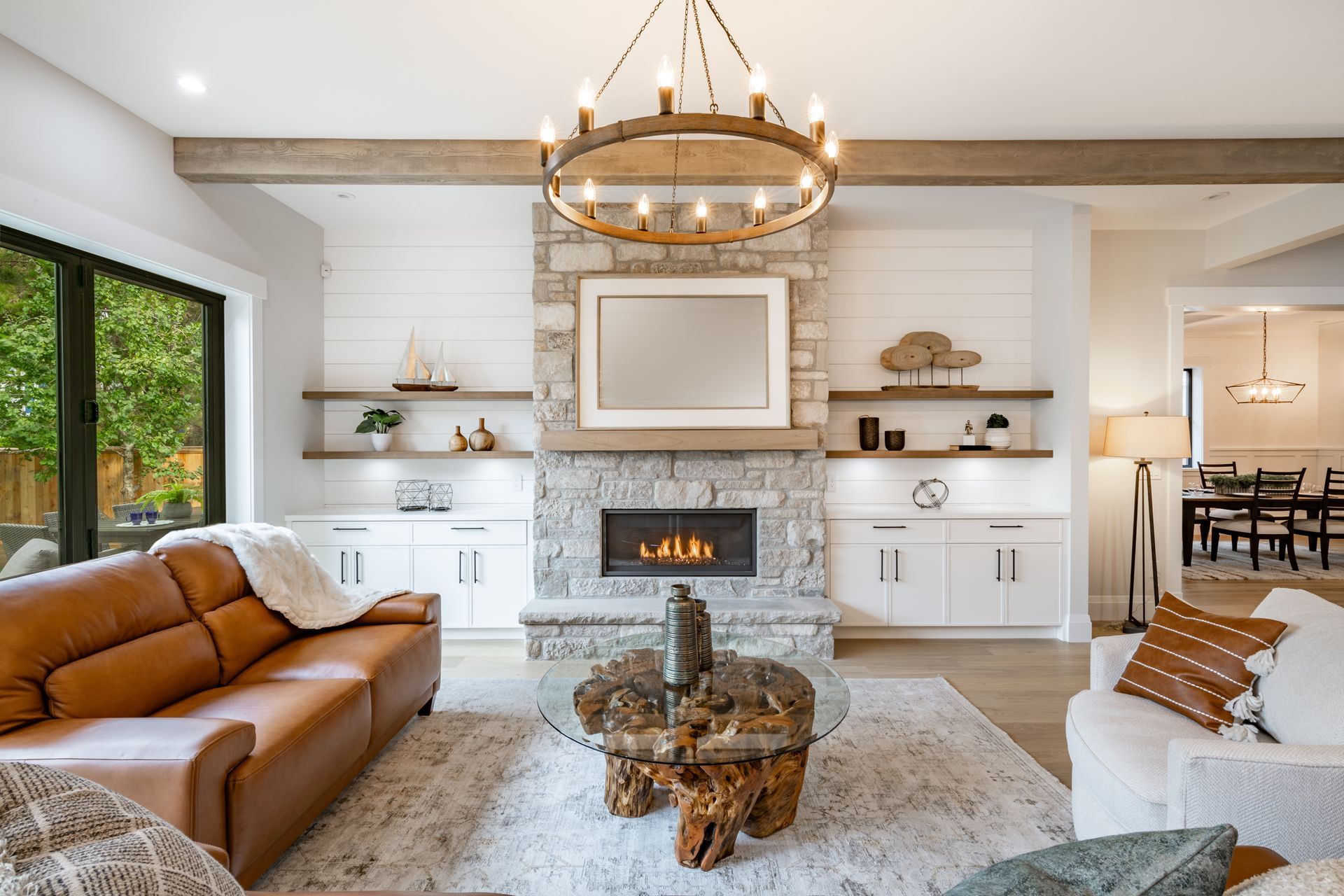 There is a fireplace in the middle of the living room.