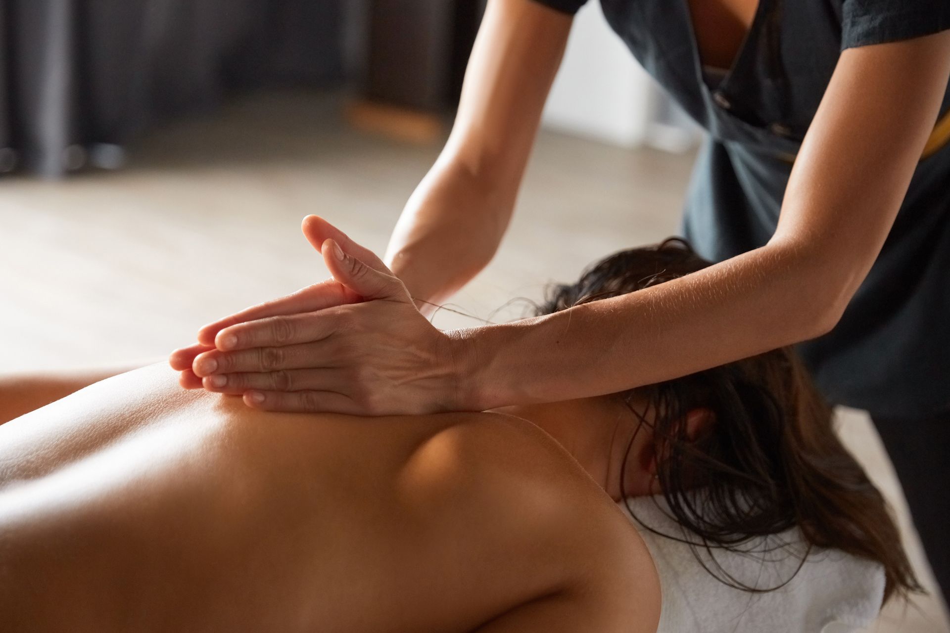 A woman is getting a massage at a spa.