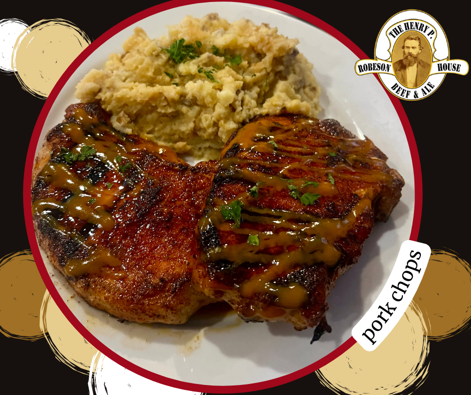 Grilled pork chops with sauce and mashed potatoes on a white plate with decorative branding in the corners