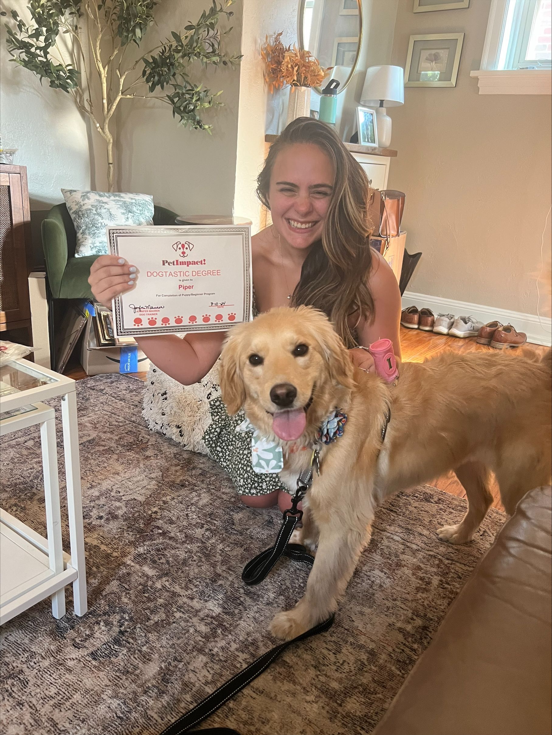 A Woman Is Holding a Sign Next to A Dog — St. Louis, MO — PetImpact!