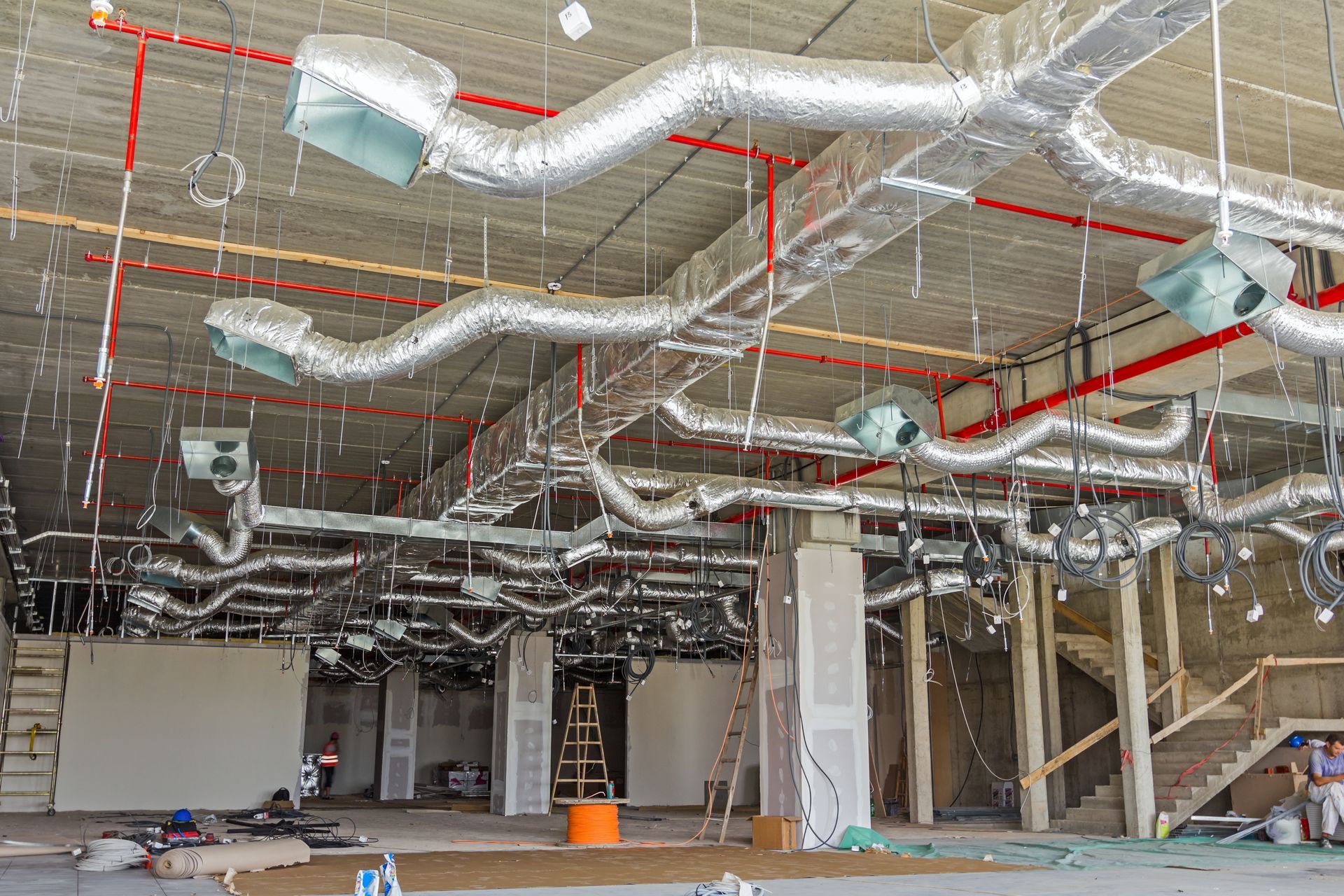 Commercial hanging air vents in a warehouse.  