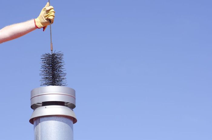 putting sweep brush inside the chimney
