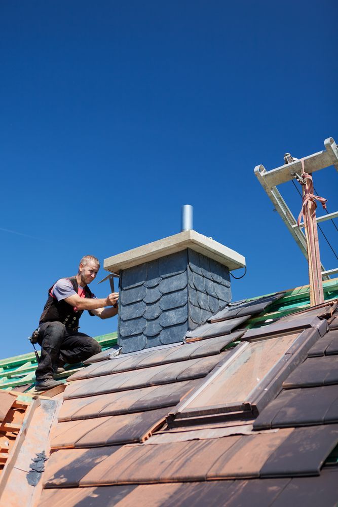 man repairing a residential chimney