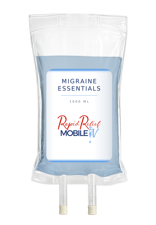 Clear IV bag labeled “Migraine Essentials” with blue fluid and tubes