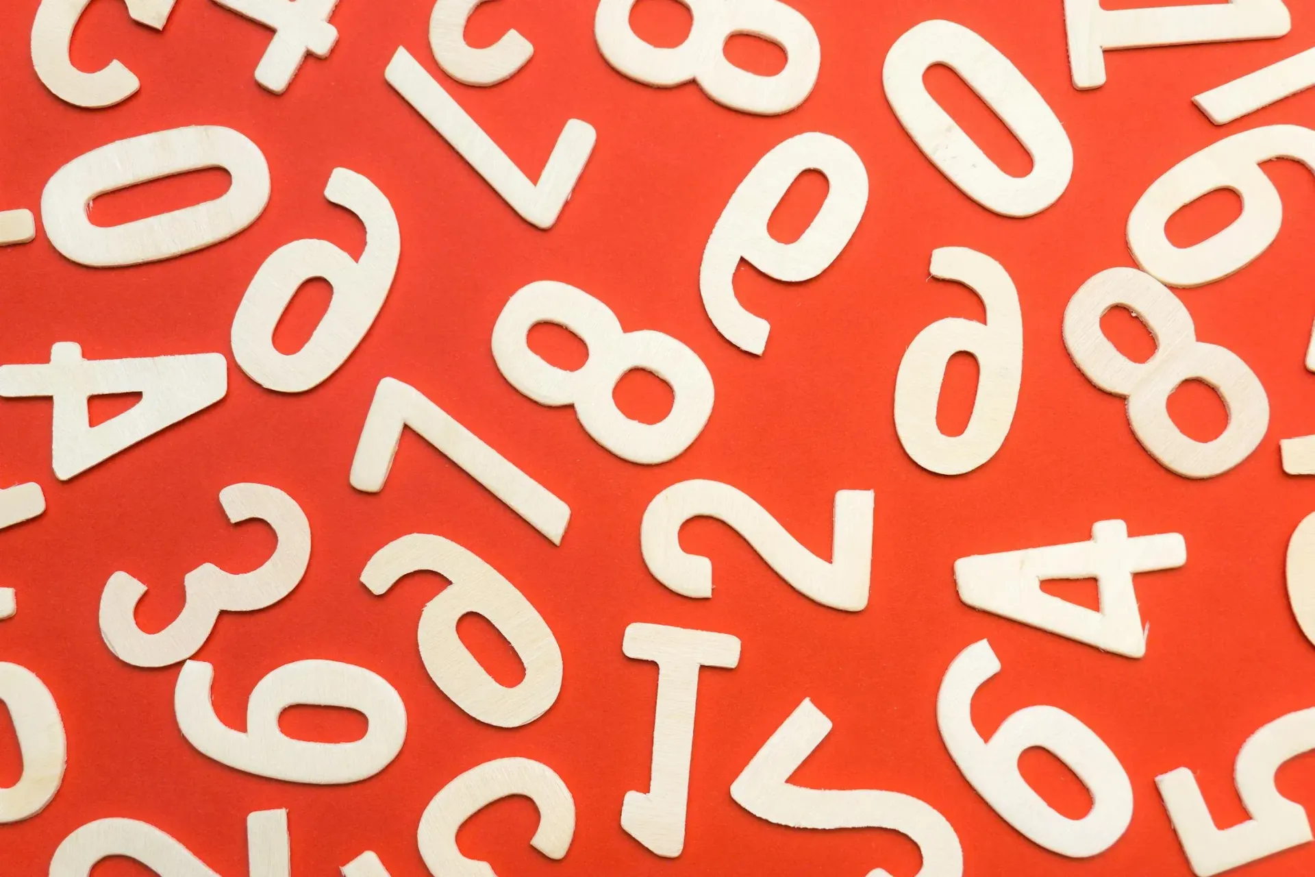 A bunch of white numbers on a red background