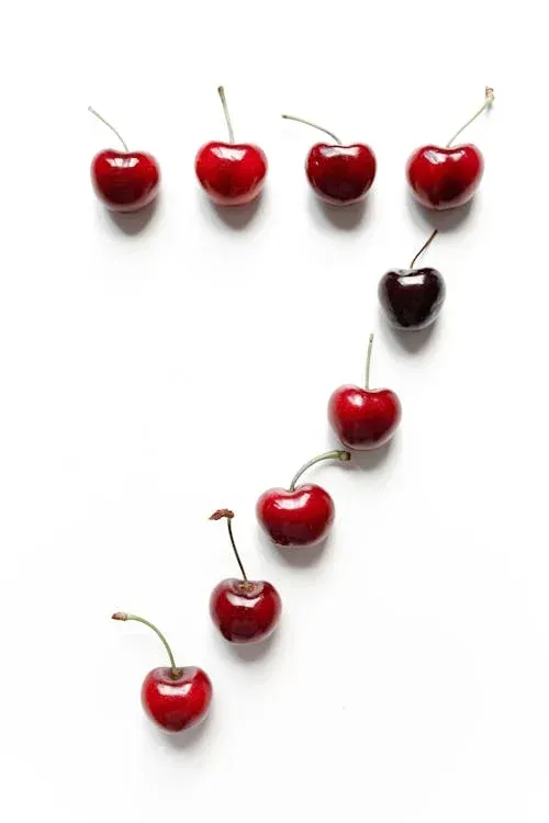 A row of cherries arranged in the shape of the number 7