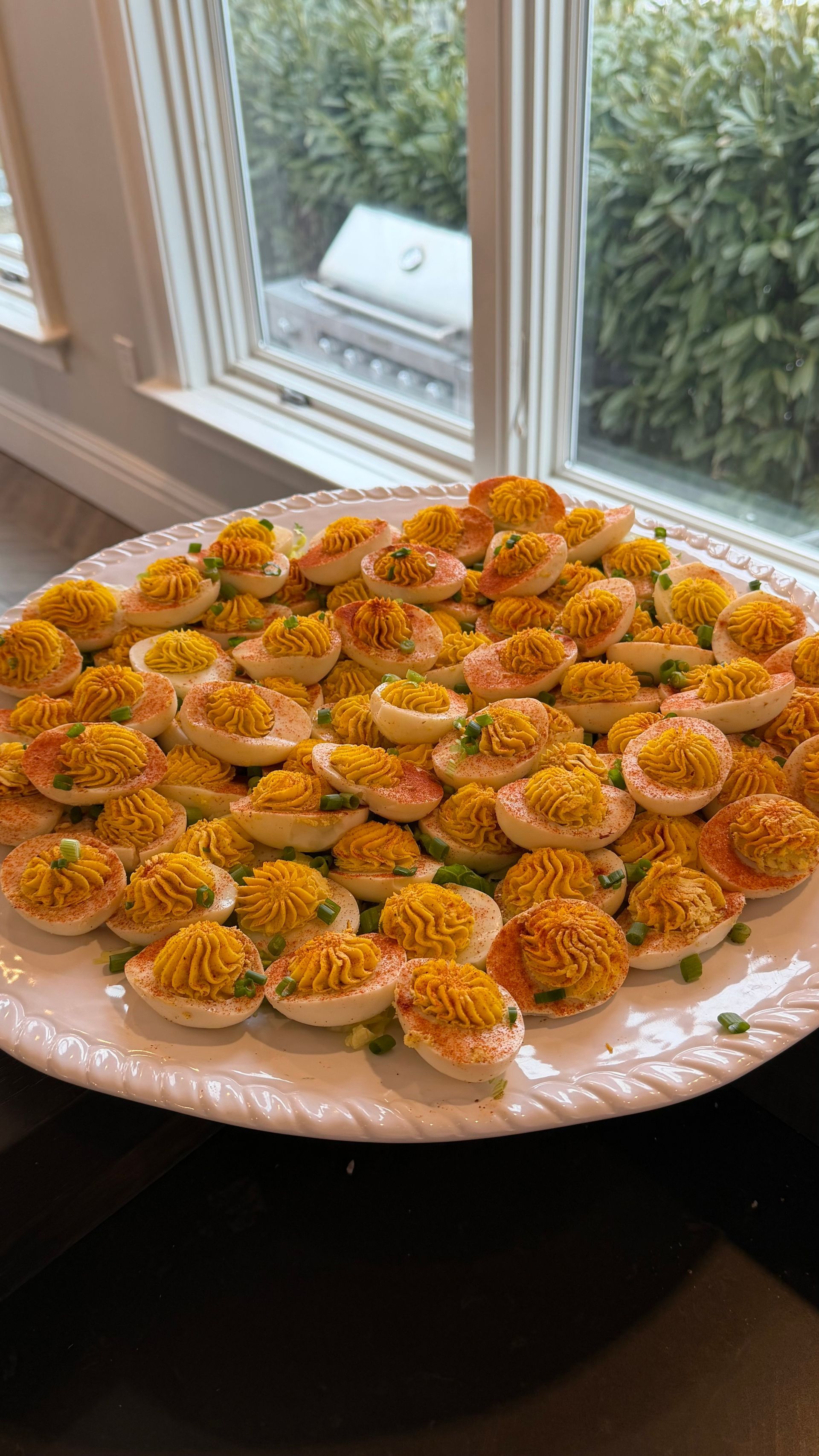 A plate filled with devilled eggs