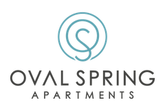 Oval Spring Apartments logo with teal circular spring icon and gray text on white background