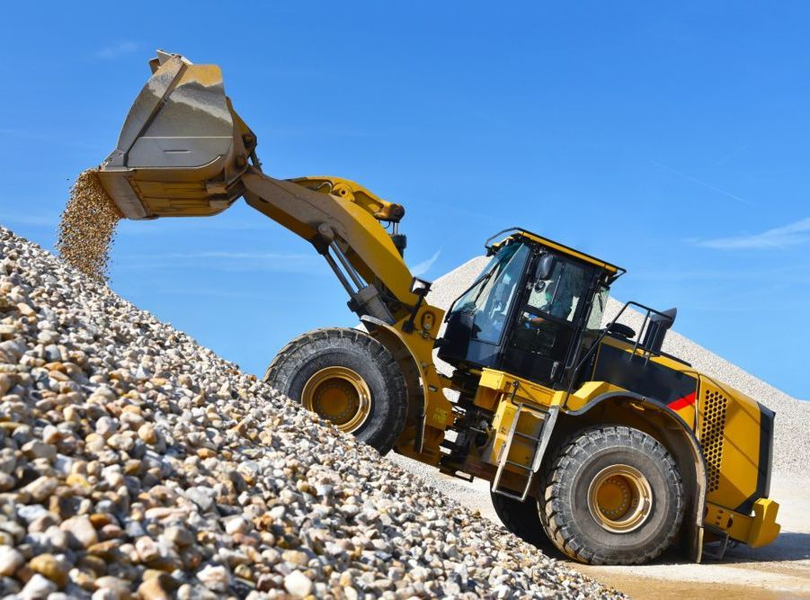 A Bulldozer Is Loading Rocks  — Dubbo Hardcore Soils & Earthmoving In Dubbo, NSW