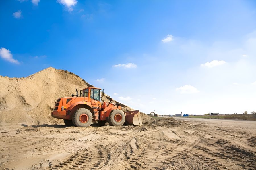 A Bulldozer is Sitting on Top of a Pile of Dirt — Dubbo Hardcore Soils & Earthmoving In Dubbo, NSW