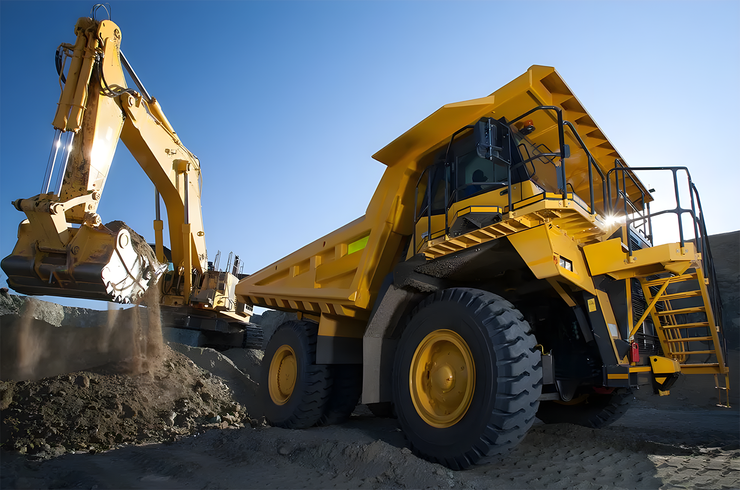 Excavator Loading Soil Into Dump Truck
