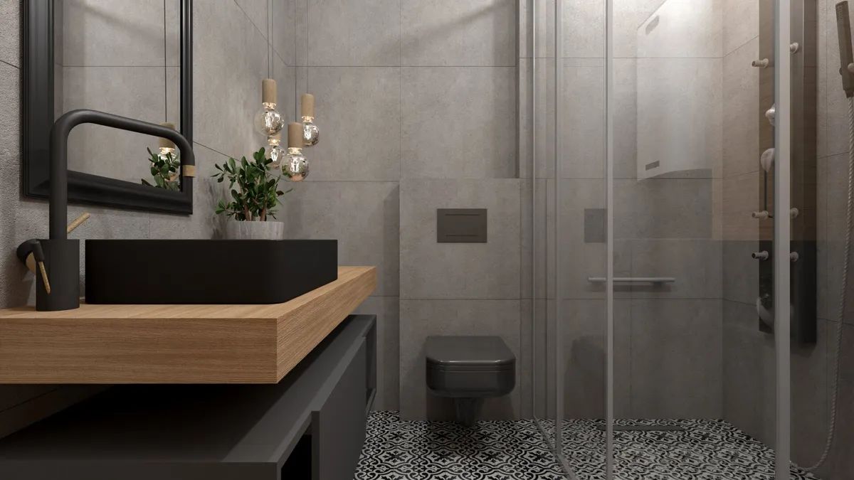 A bathroom with a sink , toilet , mirror and shower.