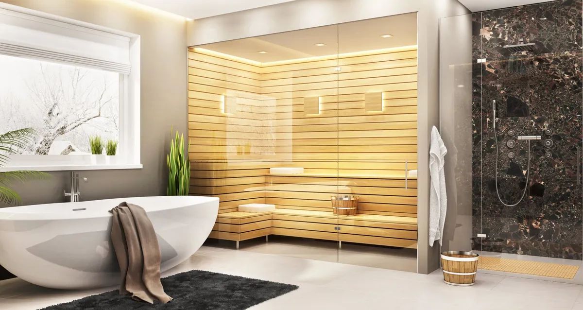 A bathroom with a tub , shower , and window.