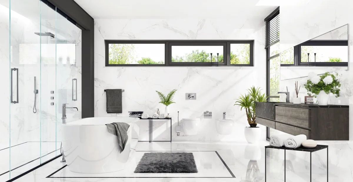 A bathroom with a bathtub , sink , and shower.
