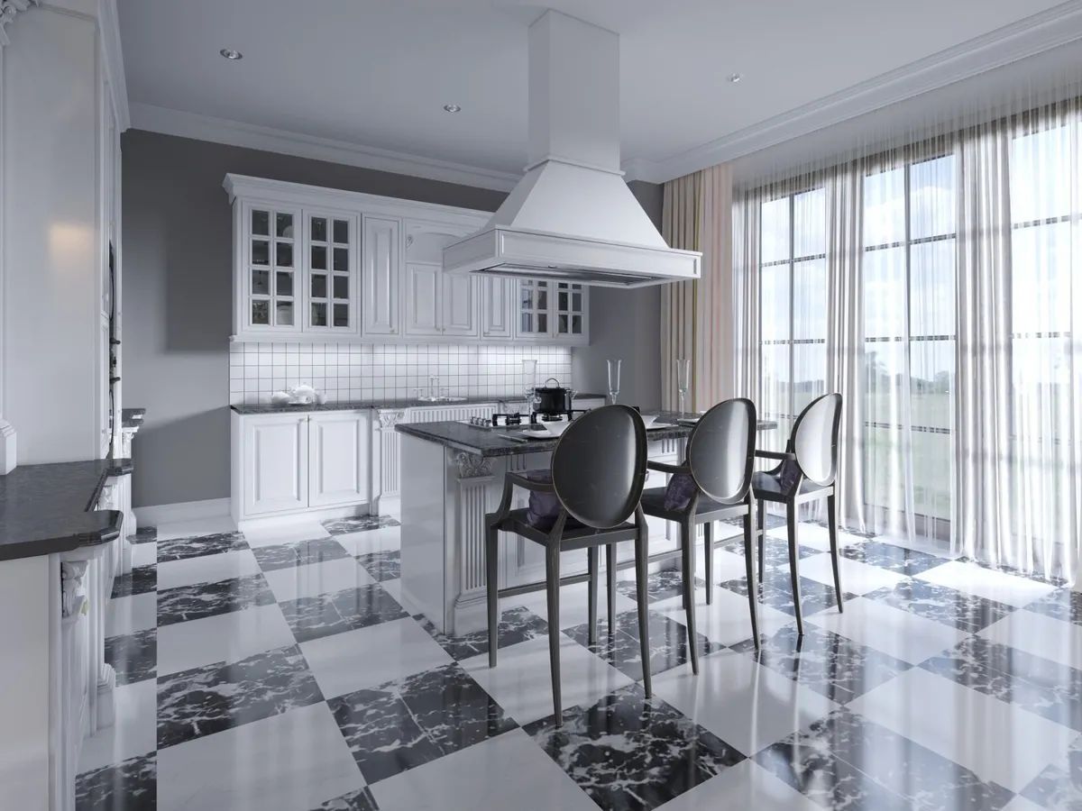 A kitchen with a checkered floor , white cabinets , a stove and a hood.