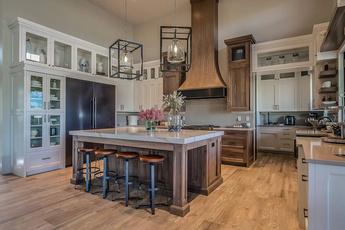 There is a large island in the middle of the kitchen.