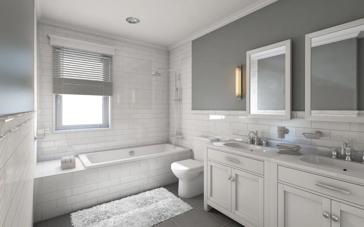 A bathroom with a tub , sink , toilet and mirrors.