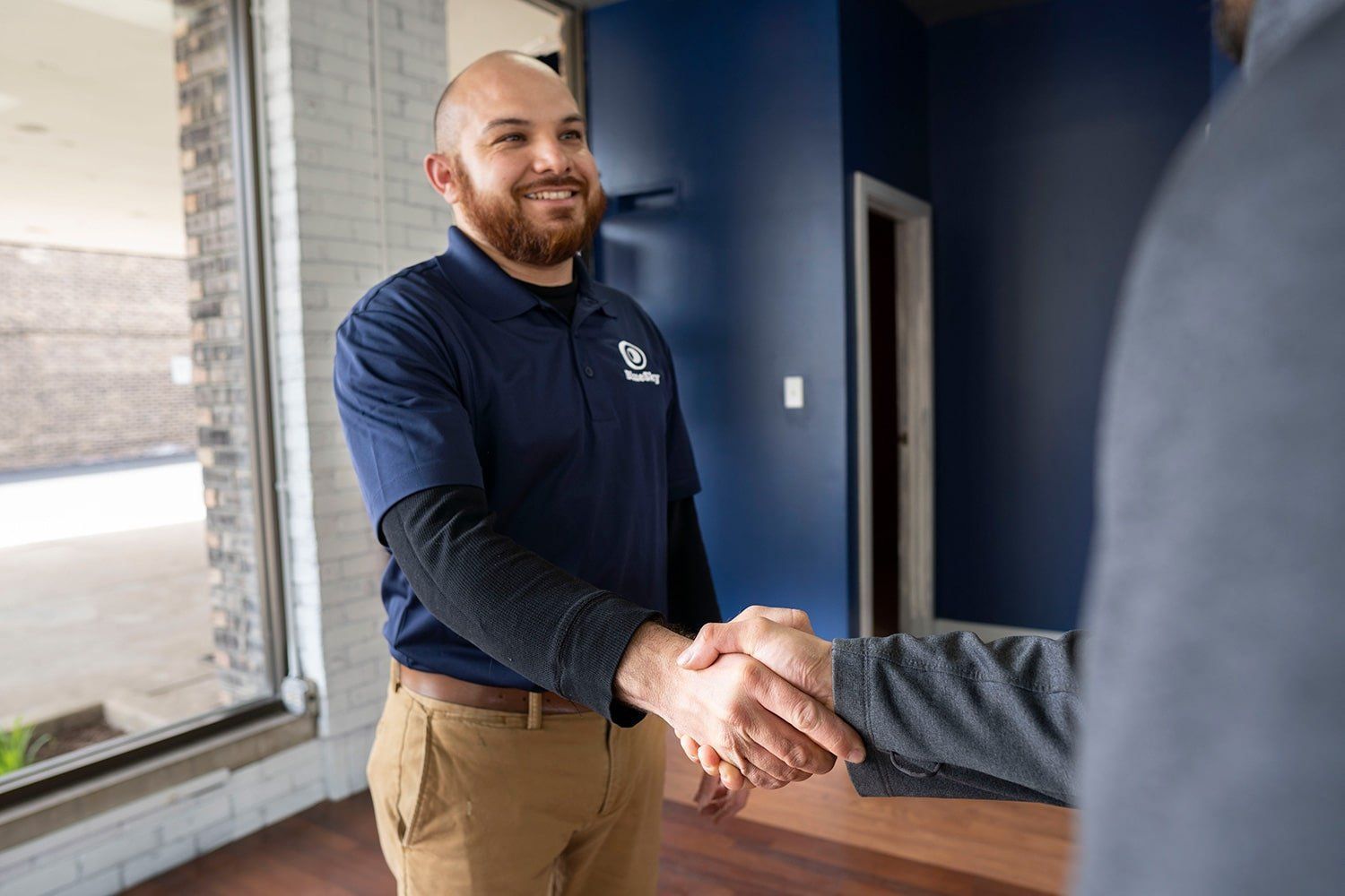 Customer reviewing auto repair financing options at BlueSky Tire & Auto
