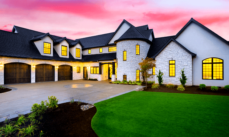 modern stone and stucco mansion with black windows and black roof