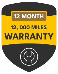 Black and yellow warranty badge reading “12 Month 12,000 Miles Warranty” with a wrench icon | Mallard Auto Care