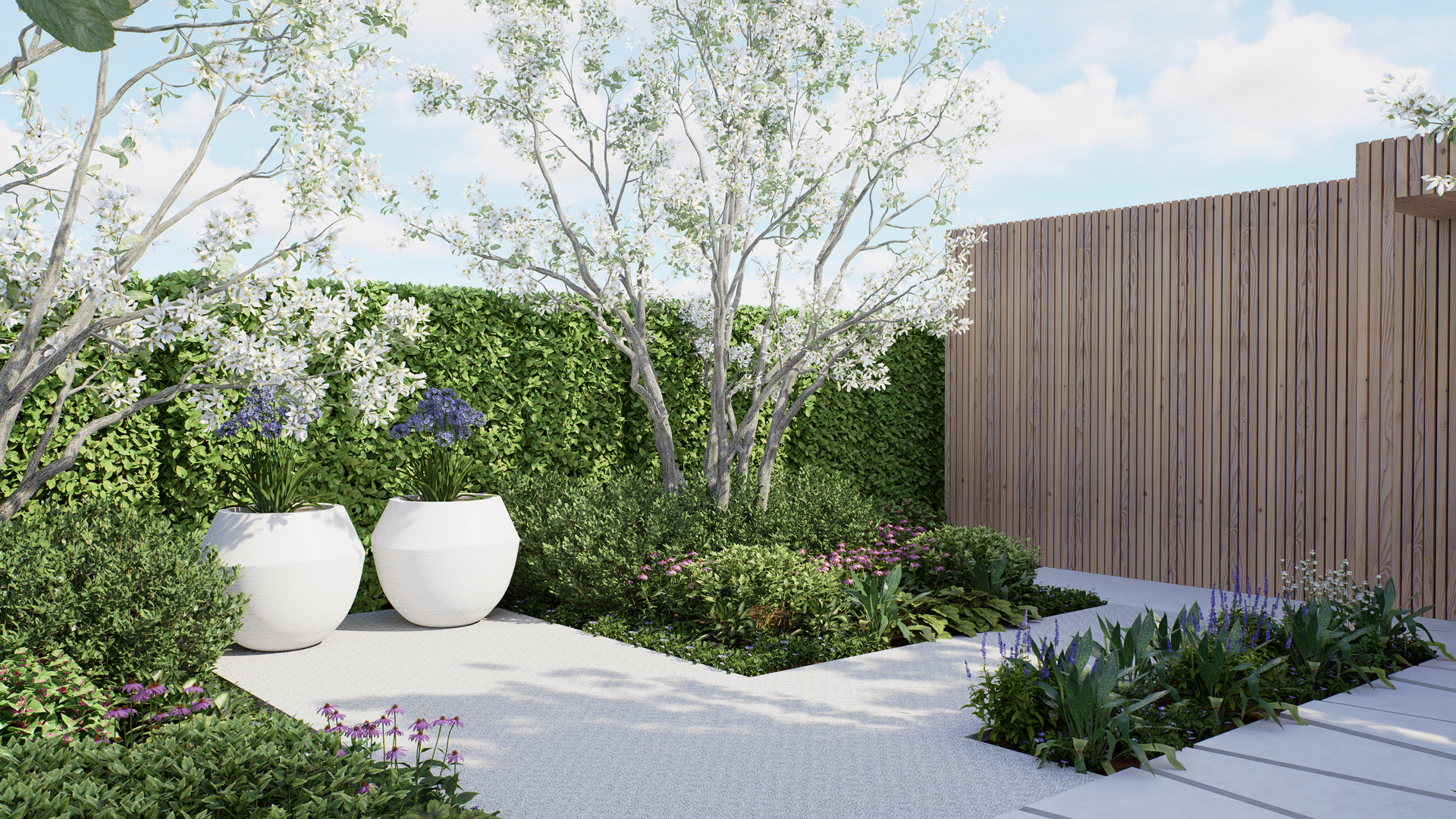 Landscaped garden with white gravel paths, wooden fence, and flowering trees.