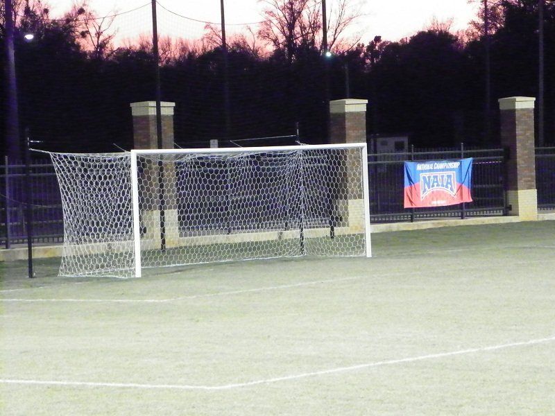A soccer goal with a banner that says nfl on it