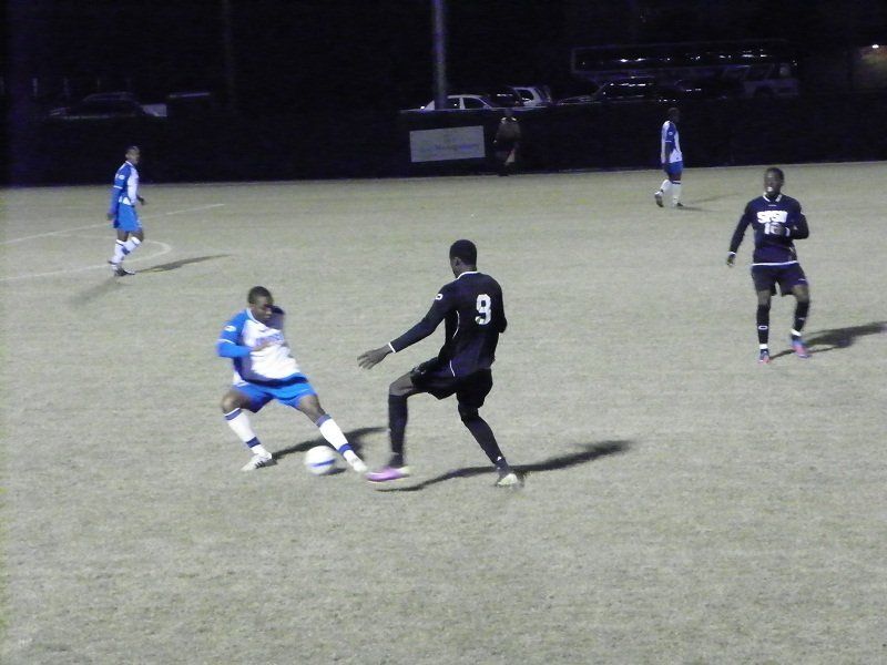 A soccer player with the number 9 on his jersey