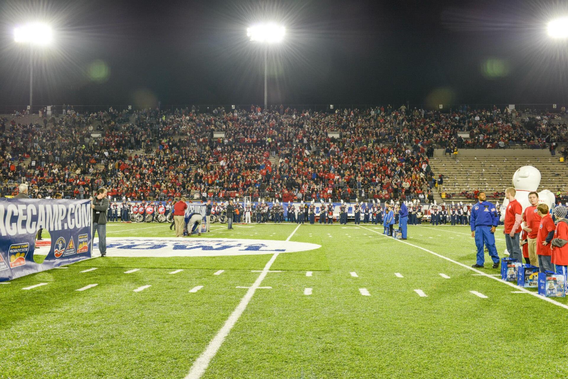 A football field with a banner that says racecamp.com on it