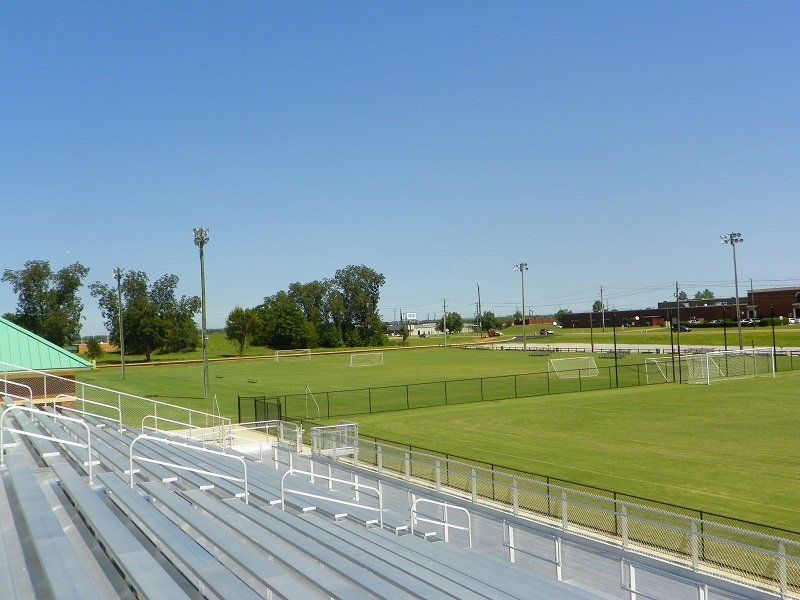 A view of a soccer field from the stands of a stadium