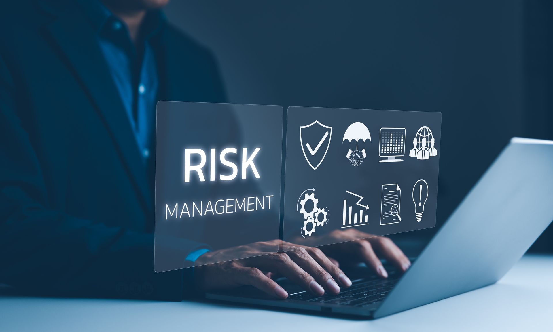 A hand is holding a wooden block with the word risk written on it.