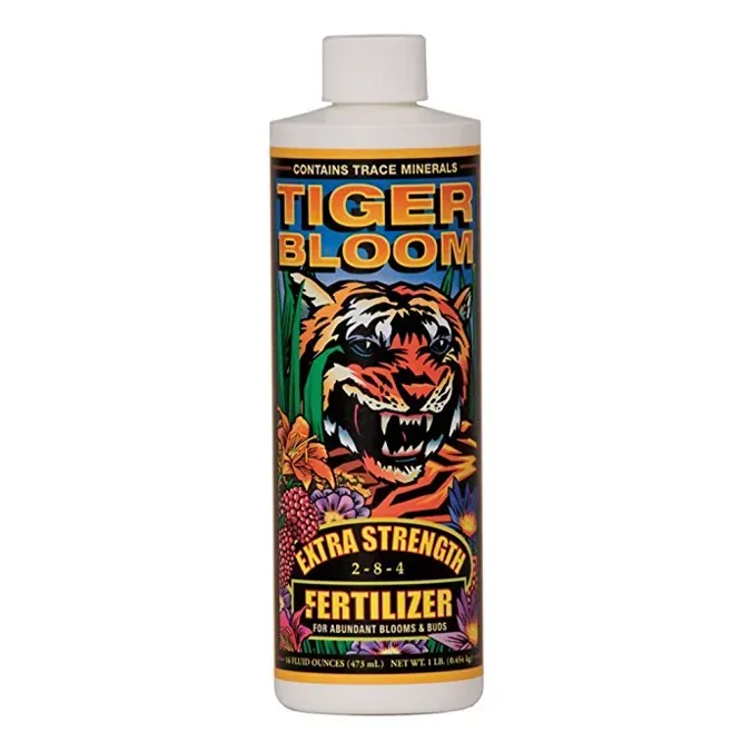 Bottle of Tiger Bloom fertilizer with a tiger label on a white background