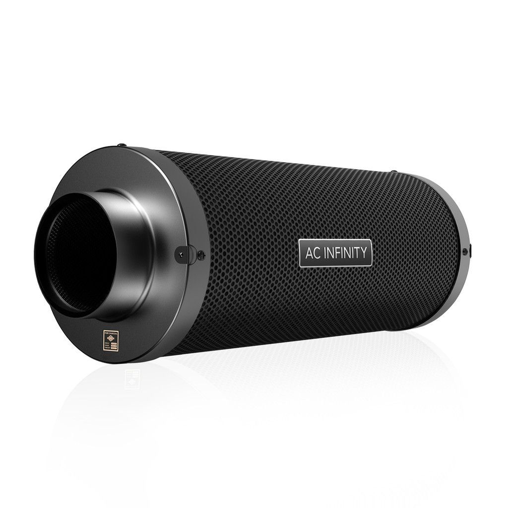 Black cylindrical portable speaker with textured mesh and silver front ring on a white background