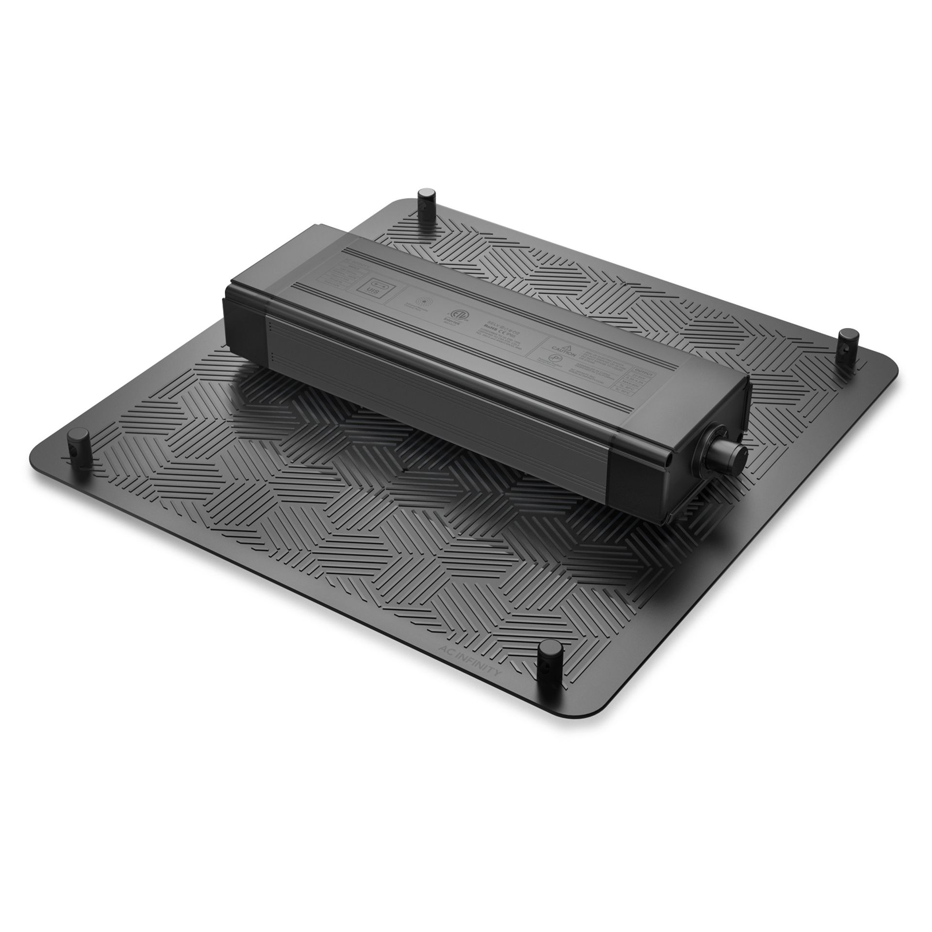 Black tabletop device with a rectangular unit on a patterned base and four corner posts