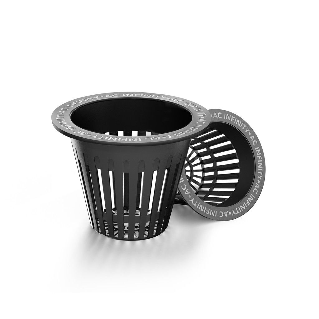 Black plastic trash can with lid leaning against it on a white background