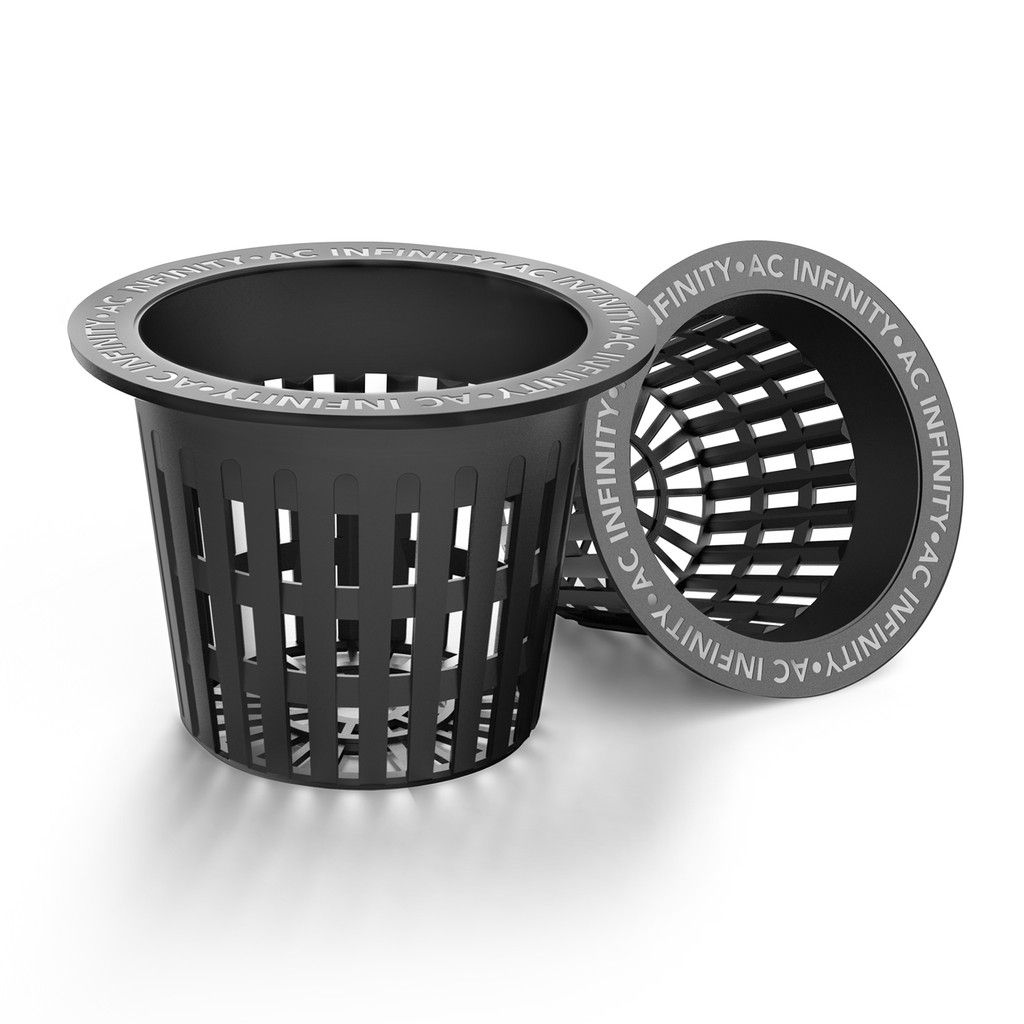 Black perforated plastic trash bin with a removable inner liner on a white background