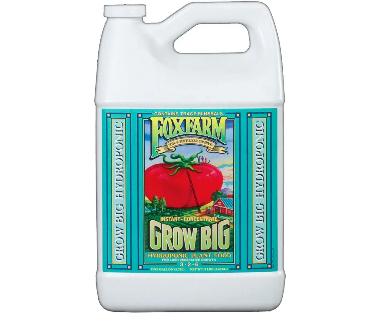 White jug of FoxFarm Grow Big liquid fertilizer with a red tomato label.