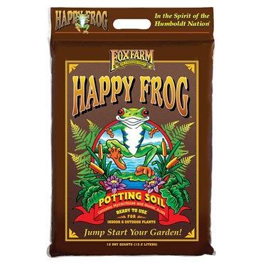 Happy Frog potting soil bag with bright frog illustration on a brown package