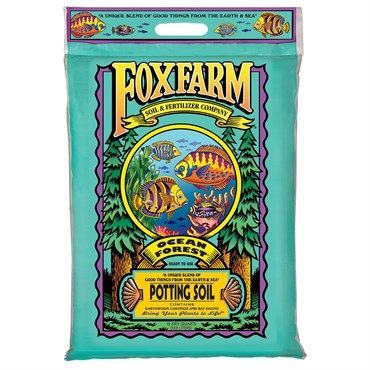 FoxFarm potting soil bag in turquoise, yellow, and purple with fish illustration and bold logo.