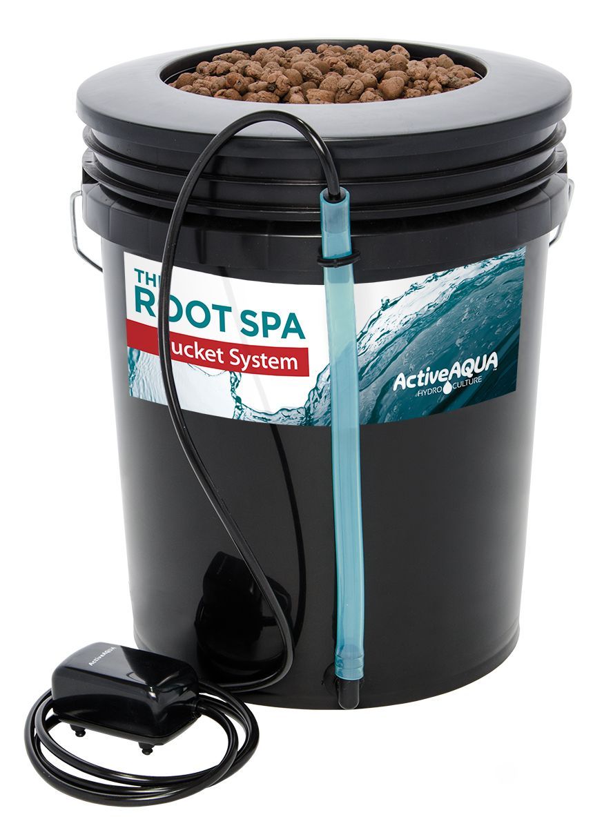 Black hydroponic bucket with lid, clay pebbles, tubing, and a small pump on a white background